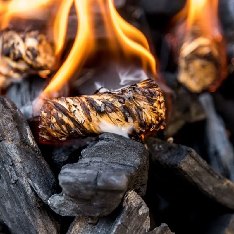 If you’re using fire starters, wedge a couple into the charcoal just under the top layer of charcoal.