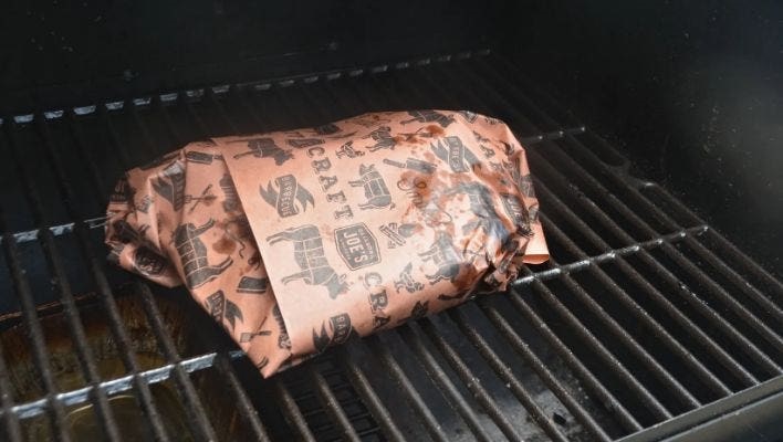 Wrap the brisket point in butcher paper and smoke until tender